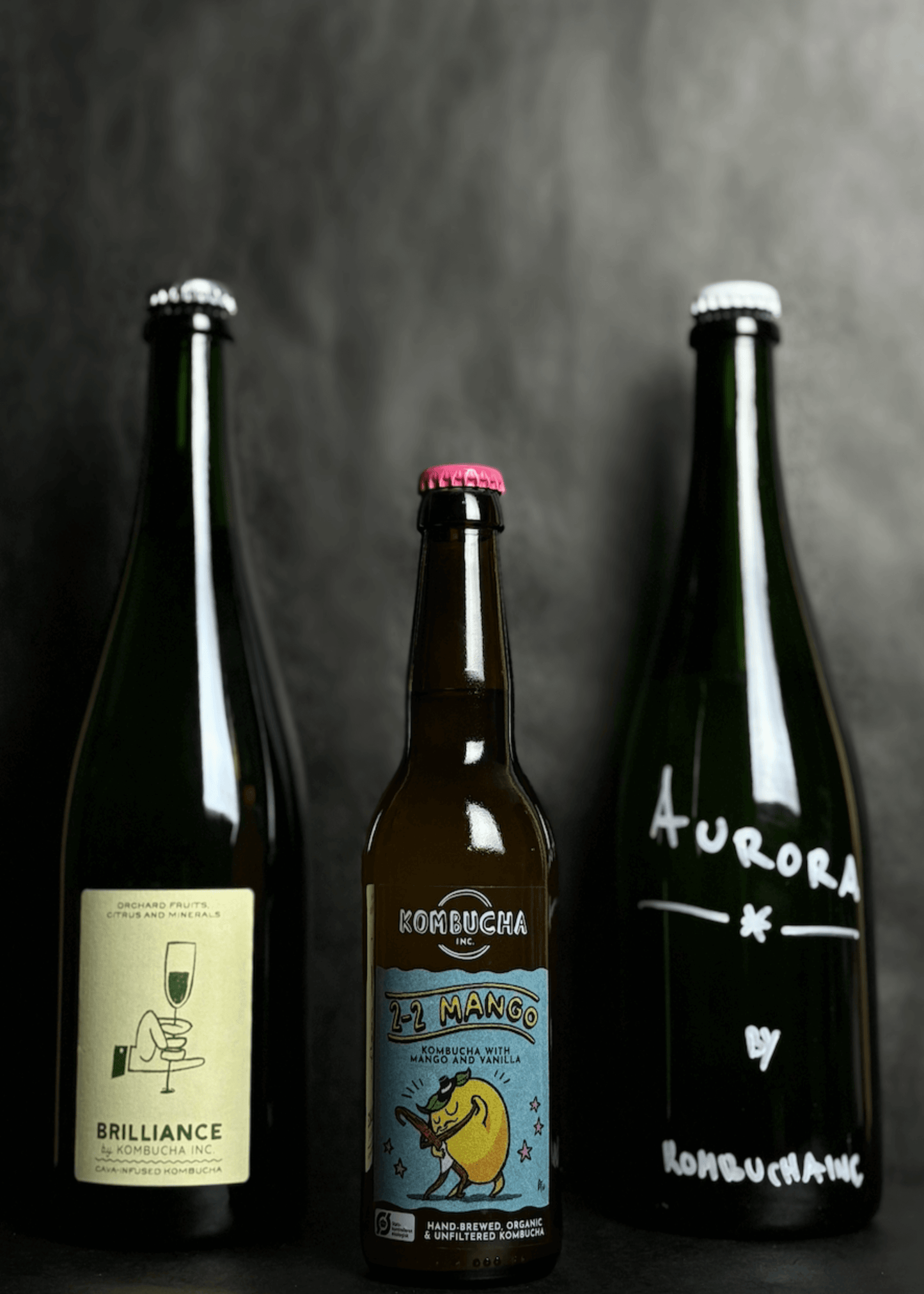 Kombucha Inc. The Starter Pack bundle featuring mango, yuzu, and cava kombuchas, offering a unique selection of low-alcohol beverages crafted with high-quality ingredients. Each flavor delivers a sophisticated experience, perfect for those seeking a bold and refined alternative to traditional drinks.