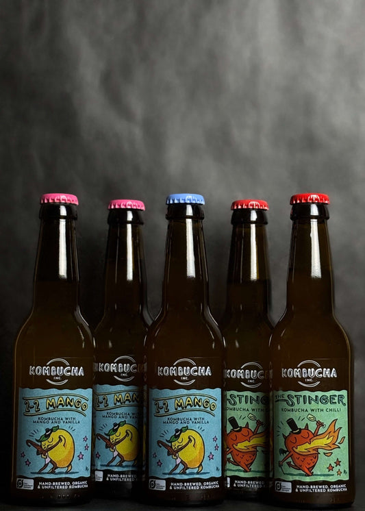 Kombucha Inc. five-pack mango chili bundle, featuring a bold blend of tropical mango and spicy chili in handcrafted, low-alcohol kombucha made with high-quality ingredients for a unique, flavorful experience.