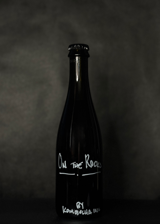 Kombucha Inc. On the Rocks, a low-alcohol whiskey-aged kombucha with rich coffee notes, offering a bold and unique drinking experience. Crafted with high-quality ingredients, this fermented beverage combines the depth of whiskey aging with the richness of coffee for a sophisticated and distinct flavor